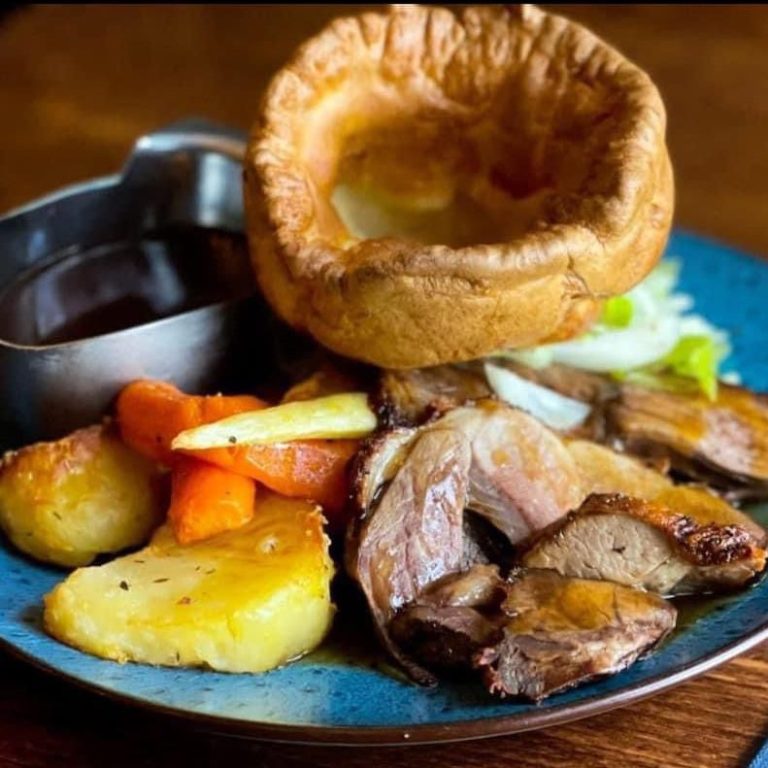 Our famous Sunday Roast, with tender roast beef, Yorkshire pudding, seasonal vegetables, roast potatoes and gravy, at The Stag Pub and Kitchen in Flackwell Heath.